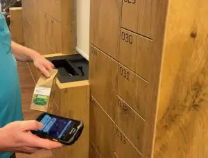Employee scans barcode of medicine package
